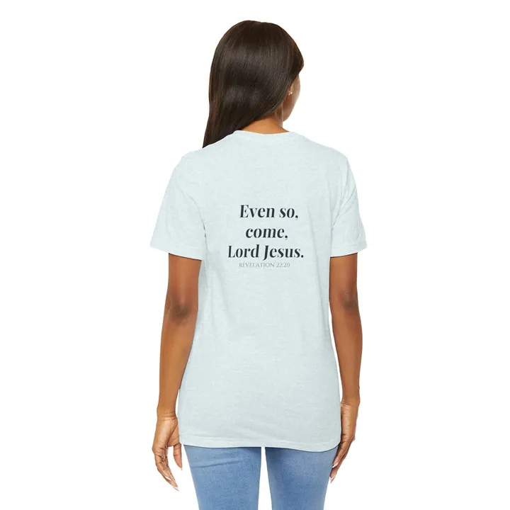 Woman seen from behind in a light blue T-shirt with Even so, come, Lord Jesus printed on the back